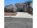 Charming two-story home with a well-manicured lawn and a spacious driveway at 6529 Bradford Ln, Las Vegas, NV 89108