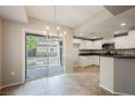 This bright kitchen boasts stainless steel appliances and white cabinets with outdoor access at 6868 Sky Pointe Dr # 1112, Las Vegas, NV 89131