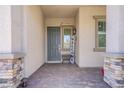 Inviting front porch with a welcoming entrance and stone accents at 709 Corelli Cove St, Henderson, NV 89011