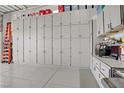 Spacious garage featuring ample storage with wall-to-wall cabinets at 709 Corelli Cove St, Henderson, NV 89011