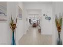 Bright hallway flows through the home, showcasing neutral colors and modern decor, leading to the main living areas at 709 Corelli Cove St, Henderson, NV 89011