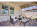Enjoy the cozy patio with comfortable seating, perfect for relaxing and entertaining outdoors at 709 Corelli Cove St, Henderson, NV 89011
