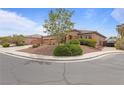 Single-story home with desert landscaping, including shrubs and succulents, with a three car garage at 7719 Villa Montara St, Las Vegas, NV 89123