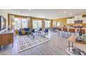 Open-concept living room features modern furniture, neutral color palette and lots of natural light at 794 Calm Crystal Ct # Lot 139, North Las Vegas, NV 89081