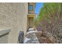 Inviting front entrance with a well-lit walkway and manicured landscaping at 8469 Cheerful Brook Ave, Las Vegas, NV 89143