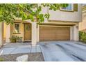 Exterior view of a two-story home with a two-car garage at 10931 Sardinia Sands Dr, Las Vegas, NV 89141