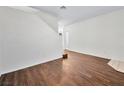 Living room featuring wood-look flooring and neutral paint palette at 1153 Stormy Valley Rd, Las Vegas, NV 89123