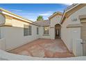 Charming front patio featuring a stamped concrete design and inviting entryway to the home at 2309 Tedesca Dr, Henderson, NV 89052