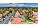 An aerial view of a beautiful residential neighborhood with mature landscaping, swimming pools and terra cotta tile roofs at 2704 Miraflores Ave, Las Vegas, NV 89102