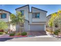 Charming two-story home with neat landscaping and a two-car garage, perfect for suburban living at 28 Verde Rosa Dr, Henderson, NV 89011