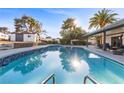 Inviting backyard with a refreshing pool, patio area, and verdant landscaping at 2885 Horseshoe Dr, Las Vegas, NV 89120