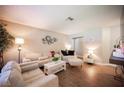 Cozy living room showcases hardwood floors, neutral paint, and a modern furniture set at 3151 Soaring Gulls Dr # 1181, Las Vegas, NV 89128