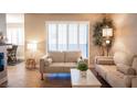 The living room is filled with natural light from a window and showcases neutral toned decor and furniture at 3151 Soaring Gulls Dr # 1181, Las Vegas, NV 89128