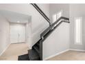 Elegant foyer featuring a black-railed staircase and wood-look floors at 3246 Brookfield Dr, Las Vegas, NV 89120