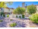 Inviting front yard with manicured landscaping and a charming brick pathway to the house at 3249 Dayflower St # C, Las Vegas, NV 89121