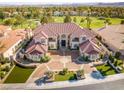Expansive home with tile roof, a circular drive, and golf course views at 35 Ventana Canyon Dr, Las Vegas, NV 89113