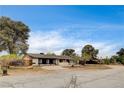 Traditional single story home with desert landscaping and a brick driveway at 3575 W Robindale Rd, Las Vegas, NV 89139