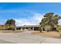 Traditional single story home with desert landscaping and brick driveway at 3575 W Robindale Rd, Las Vegas, NV 89139
