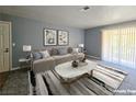 Empty living room features neutral tones and sliding glass doors at 4400 Sandy River Dr # 4, Las Vegas, NV 89103