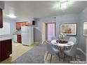 Comfortable living room with a plush sofa, modern art, and sliding doors at 4400 Sandy River Dr # 4, Las Vegas, NV 89103
