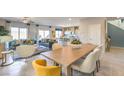 Open-concept living space boasts modern furnishings and decor, tile floors, and seamless flow with the kitchen at 4434 Bayley Skye Ave # 179, Las Vegas, NV 89141