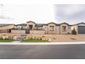 Beautiful single-story home with stone accents, meticulous landscaping, and inviting curb appeal at 5865 Alice Landing Ct, Las Vegas, NV 89149