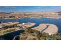 Stunning aerial view of the waterfront properties and golf course at 69 Bellissima Lago Ct, Henderson, NV 89011