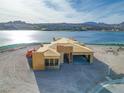 Aerial view of a new home's wood frame construction, showcasing lake views and modern design at 69 Bellissima Lago Ct, Henderson, NV 89011