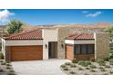 Charming single-story home with a tile roof and stone accents, nestled in a serene landscape at 69 Bellissima Lago Ct, Henderson, NV 89011