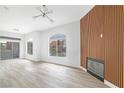 Bright and airy living room featuring hardwood flooring, modern lighting, and a fireplace at 700 Carnegie St # 3913, Henderson, NV 89052
