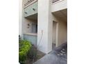 Condominium exterior with neutral colors and a small garden in front of the building at 7131 S Durango Dr # 104, Las Vegas, NV 89113