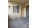 Outdoor patio with concrete flooring and a door and window to the unit at 7131 S Durango Dr # 104, Las Vegas, NV 89113