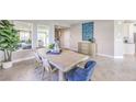 Bright and welcoming dining area featuring neutral walls, stylish furniture and a view into the entry hall at 7705 Serenity Bay Ln # Lot 57, North Las Vegas, NV 89084
