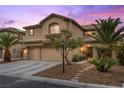 Inviting two-story home with a three-car garage, mature palm trees, and manicured landscaping at 8208 Fritzen Ave, Las Vegas, NV 89131