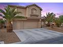 Inviting two-story home with a three-car garage, desert landscaping, and mature palm trees at 8208 Fritzen Ave, Las Vegas, NV 89131