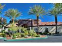 View of the Horizons Clubhouse with palm trees in front, promoting community amenities at 950 Seven Hills Dr # 114, Henderson, NV 89052