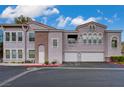 Charming condo complex featuring two-car garages and well maintained landscaping at 10001 Peace Way # 2231, Las Vegas, NV 89147