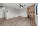 This living room has new flooring and a fireplace for a cozy atmosphere at 1112 Observation Dr # 201, Las Vegas, NV 89128