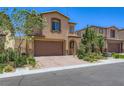 Charming two-story home featuring a two-car garage, stone accents, and professionally landscaped front yard at 12546 Mosticone Way, Las Vegas, NV 89141