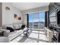 Cozy living room with a comfortable sofa, cityscape views, and a stylish accent wall at 150 Las Vegas Blvd # 1608, Las Vegas, NV 89101