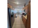 Bright kitchen showcasing stainless steel appliances and hardwood cabinetry at 1826 Dunes Ct, Laughlin, NV 89029