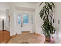 Inviting entryway with decorative tile flooring, a front door with glass, and bright white walls at 2112 Preakness Pass, Las Vegas, NV 89117