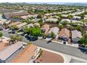 Expansive aerial view showcases a neighborhood filled with well-maintained homes and beautiful desert landscapes at 2333 Silver Crew Pass, Henderson, NV 89052