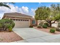 Charming single-story home features a two-car garage and desert landscaping at 2343 Galilean Moon St, Henderson, NV 89044
