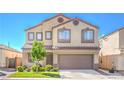 Inviting two-story home features a neutral color scheme, tile roof, and low-maintenance landscaping at 2496 Citrus Garden Cir, Henderson, NV 89052