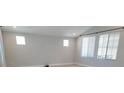 Bright living room with light walls, recessed lighting, and large windows providing ample natural light at 2726 Marchetti Pl, Henderson, NV 89044
