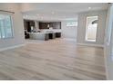 Open-concept living area featuring light floors and seamless flow into the modern kitchen and outdoor space at 2726 Marchetti Pl, Henderson, NV 89044