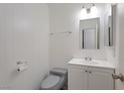 Cozy bathroom with vanity, mirror, and toilet at 3164 Richford Pl, Las Vegas, NV 89102