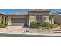 Attractive single-story home featuring a brick driveway and a two-car garage at 3434 Boleo Ct, Las Vegas, NV 89141