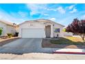 Charming single-story home with a two-car garage and a neat front yard with some desert landscaping at 3839 Dusty Glen Ct, North Las Vegas, NV 89032